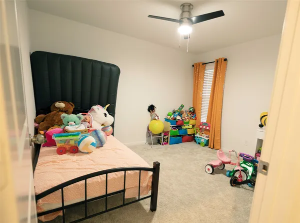 a bedroom with a bed and a table