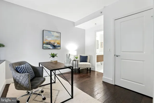 a view of a livingroom with furniture and wooden floor