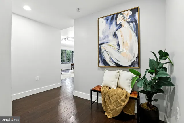 a view of a hallway with washer and dryer
