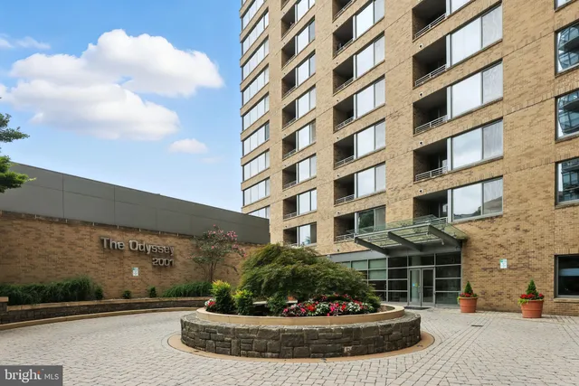 a living room with fireplace furniture and a large window