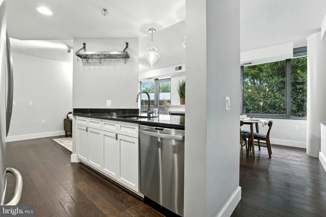 a kitchen with a table and chairs
