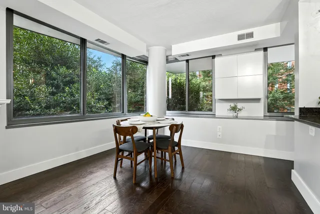 a view of a dining room with furniture window and outside view
