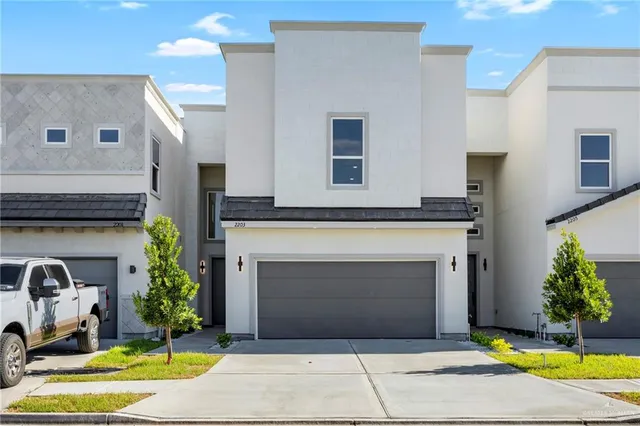 a view of a kitchen with a sink and a stove top oven