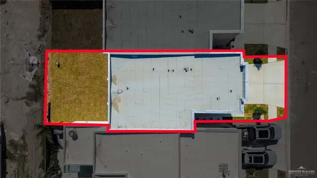 an aerial view of a house with a swimming pool