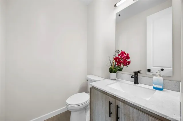 an empty room with fan and windows