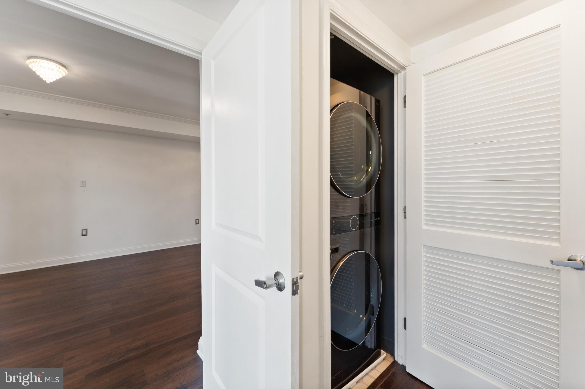 11760 Sunrise Valley Drive, Unit 809 Reston, VA 20191 - Photo 12 of 15 a view of a hallway with washer and dryer