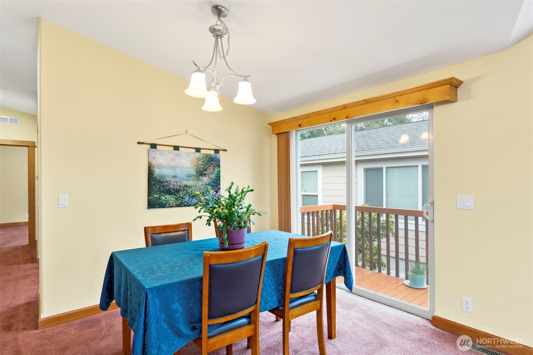 3611 I Street Northeast, Unit 424 Auburn, WA 98002 - Photo 13 of 34 a dining room with furniture potted plants and wooden floor