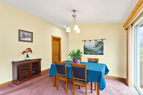 a dining room with furniture and window