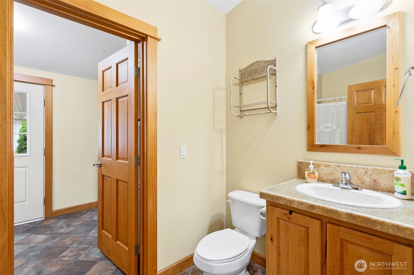 3611 I Street Northeast, Unit 424 Auburn, WA 98002 - Photo 16 of 34 a bathroom with a granite countertop sink toilet and shower