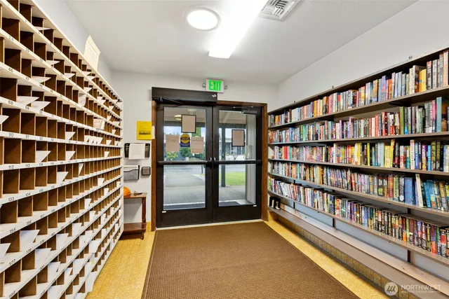 a view of room with furniture book shelf