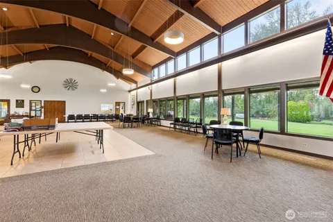 a view of a swimming pool with a table and chairs