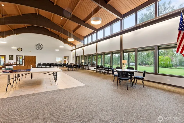 a view of a swimming pool with a table and chairs