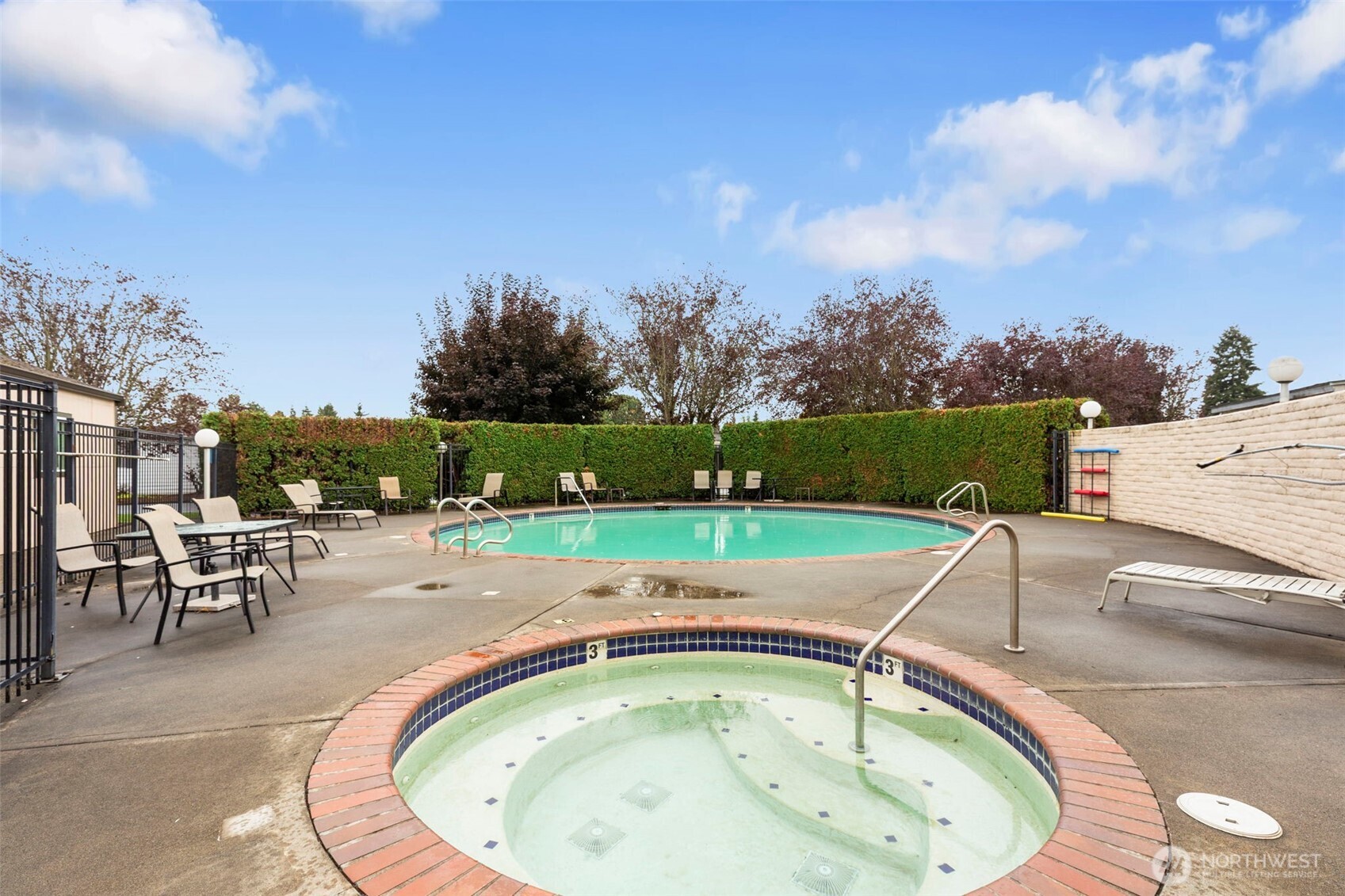 3611 I Street Northeast, Unit 424 Auburn, WA 98002 - Photo 31 of 34 an outdoor view with swimming pool and seating