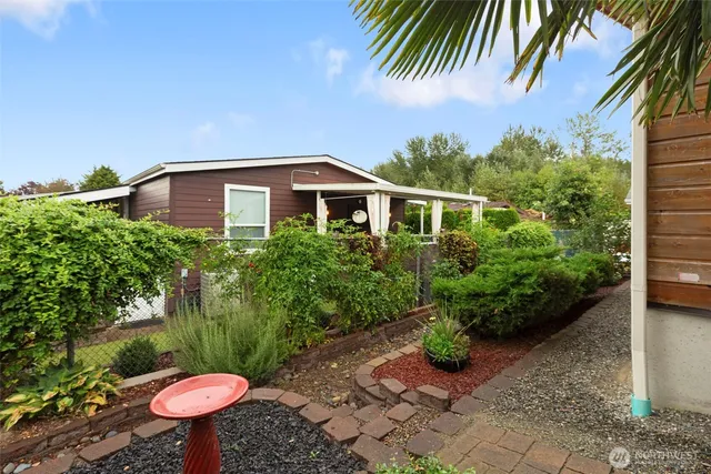 a front view of a house with garden