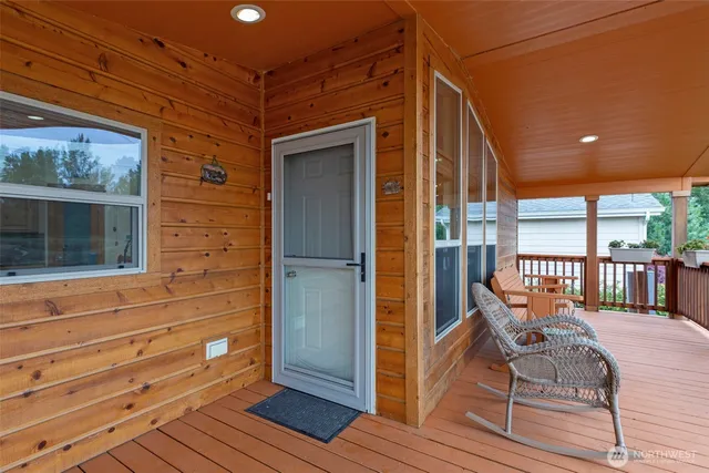 a view of a balcony with furniture