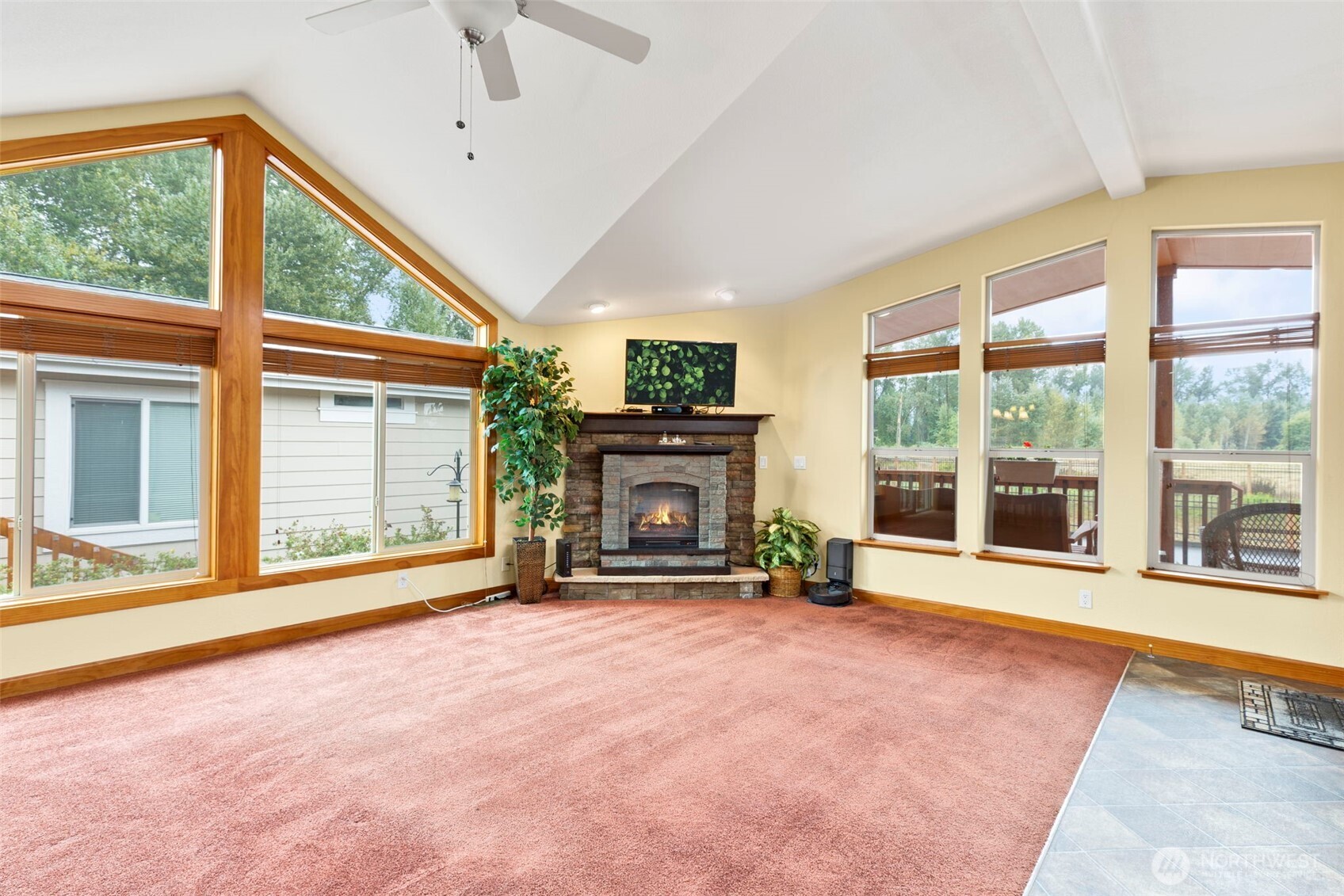3611 I Street Northeast, Unit 424 Auburn, WA 98002 - Photo 9 of 34 a view of an empty room with a fireplace and a large window