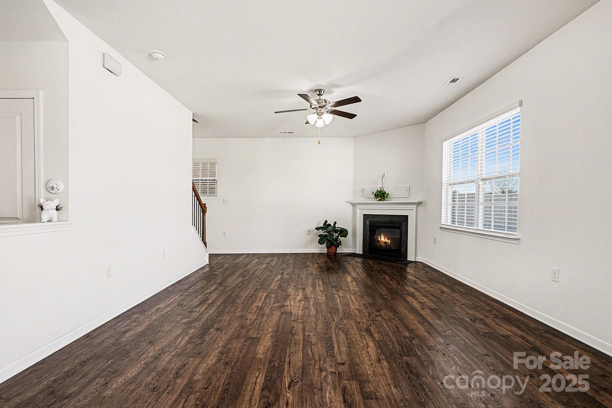 3224 Hawksbill Street Southwest Concord, NC 28027 - Photo 12 of 35 a view of an empty room with a fireplace and a window