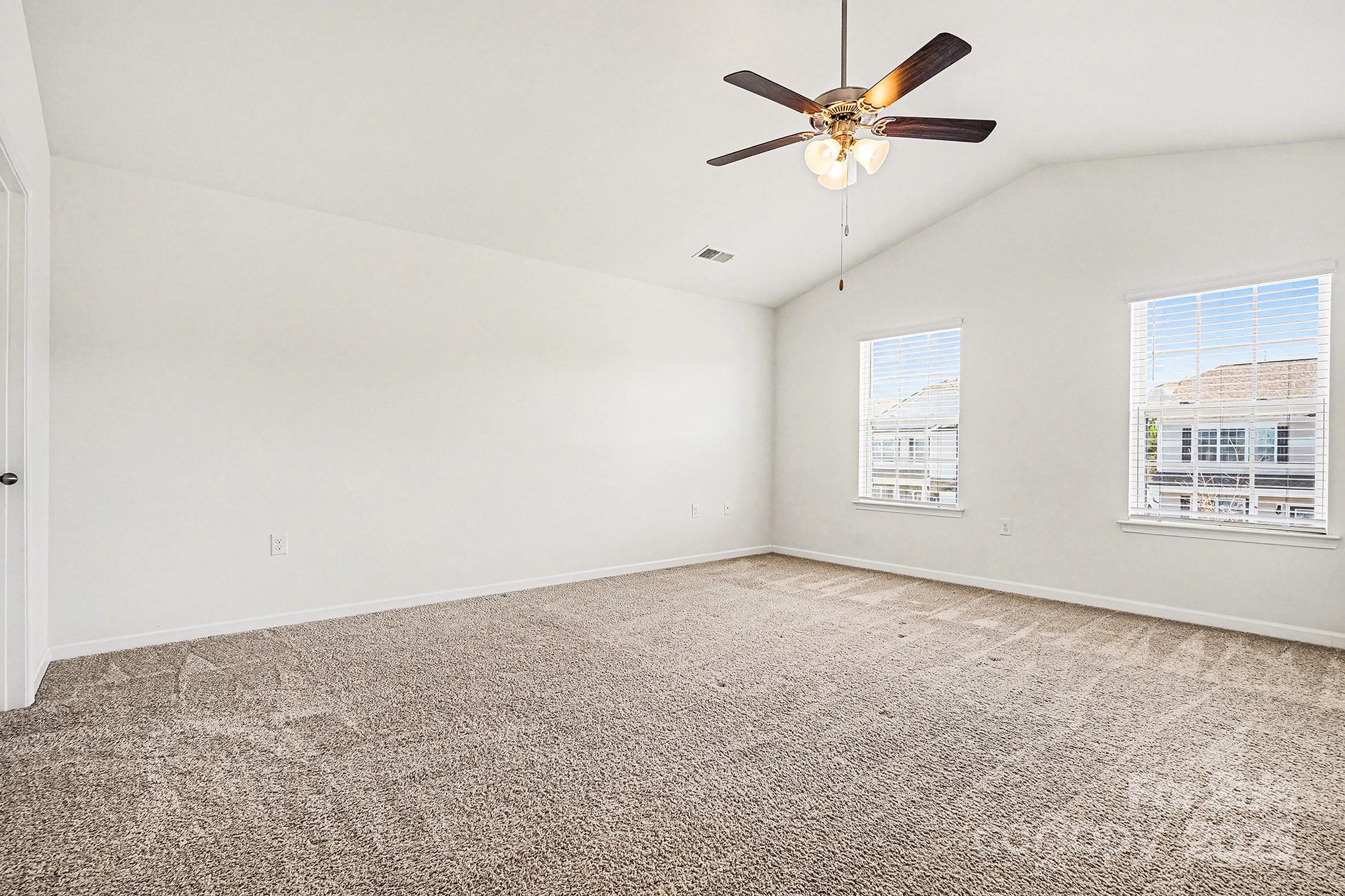 3224 Hawksbill Street Southwest Concord, NC 28027 - Photo 18 of 35 an empty room with windows and fan