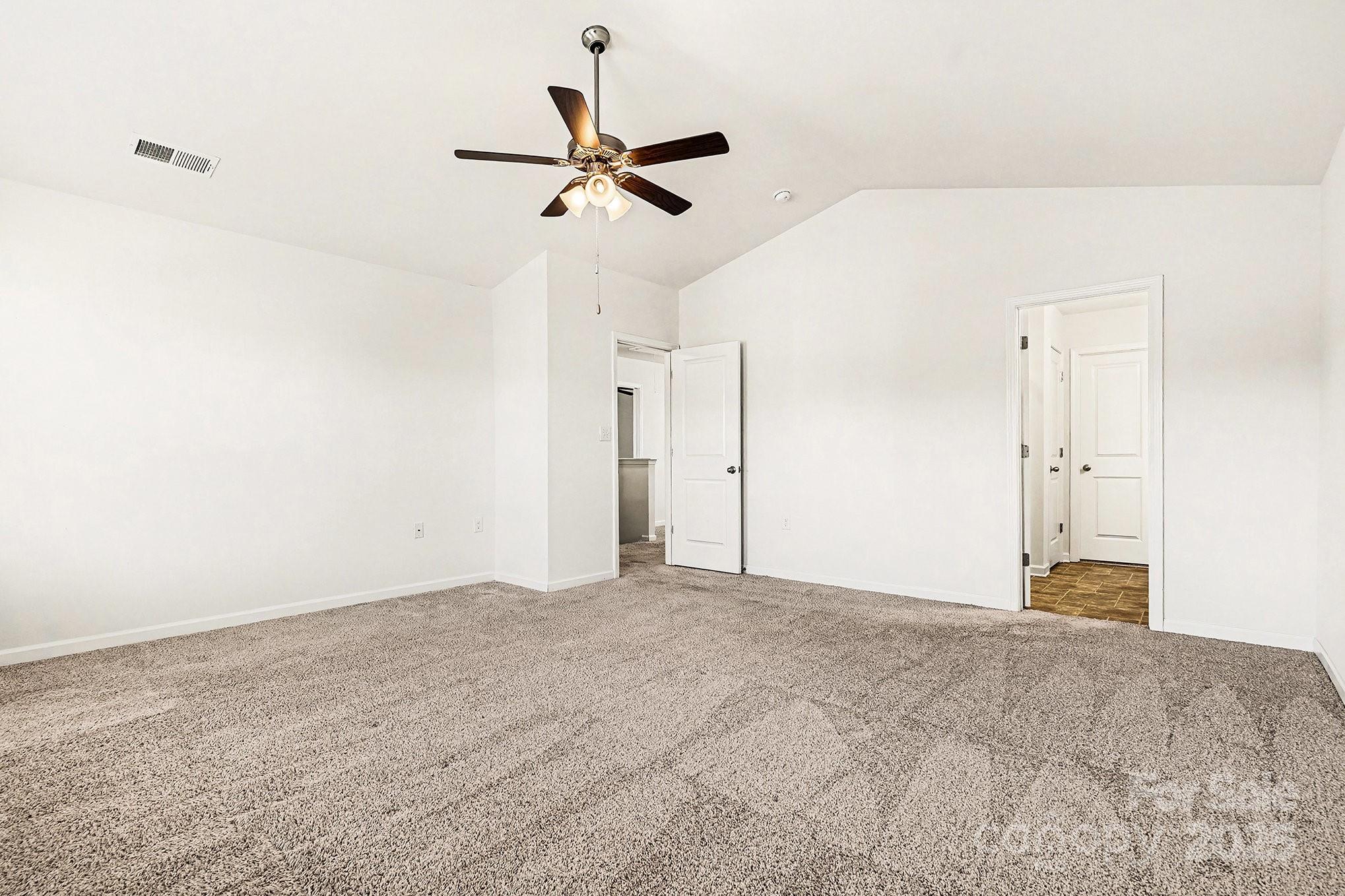 3224 Hawksbill Street Southwest Concord, NC 28027 - Photo 19 of 35 a view of a livingroom with a ceiling fan and window