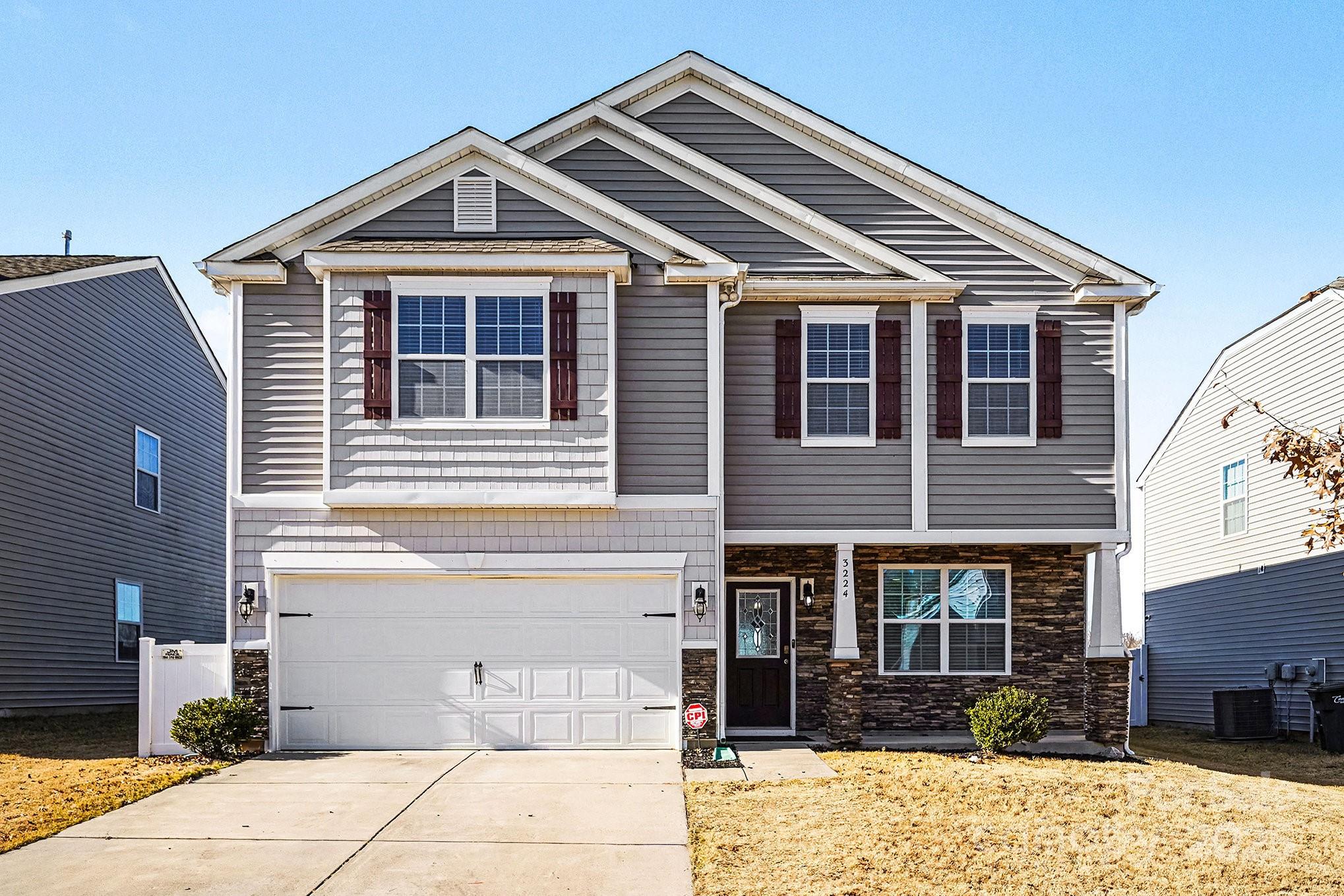 3224 Hawksbill Street Southwest Concord, NC 28027 - Photo 2 of 35 a front view of a house with a yard