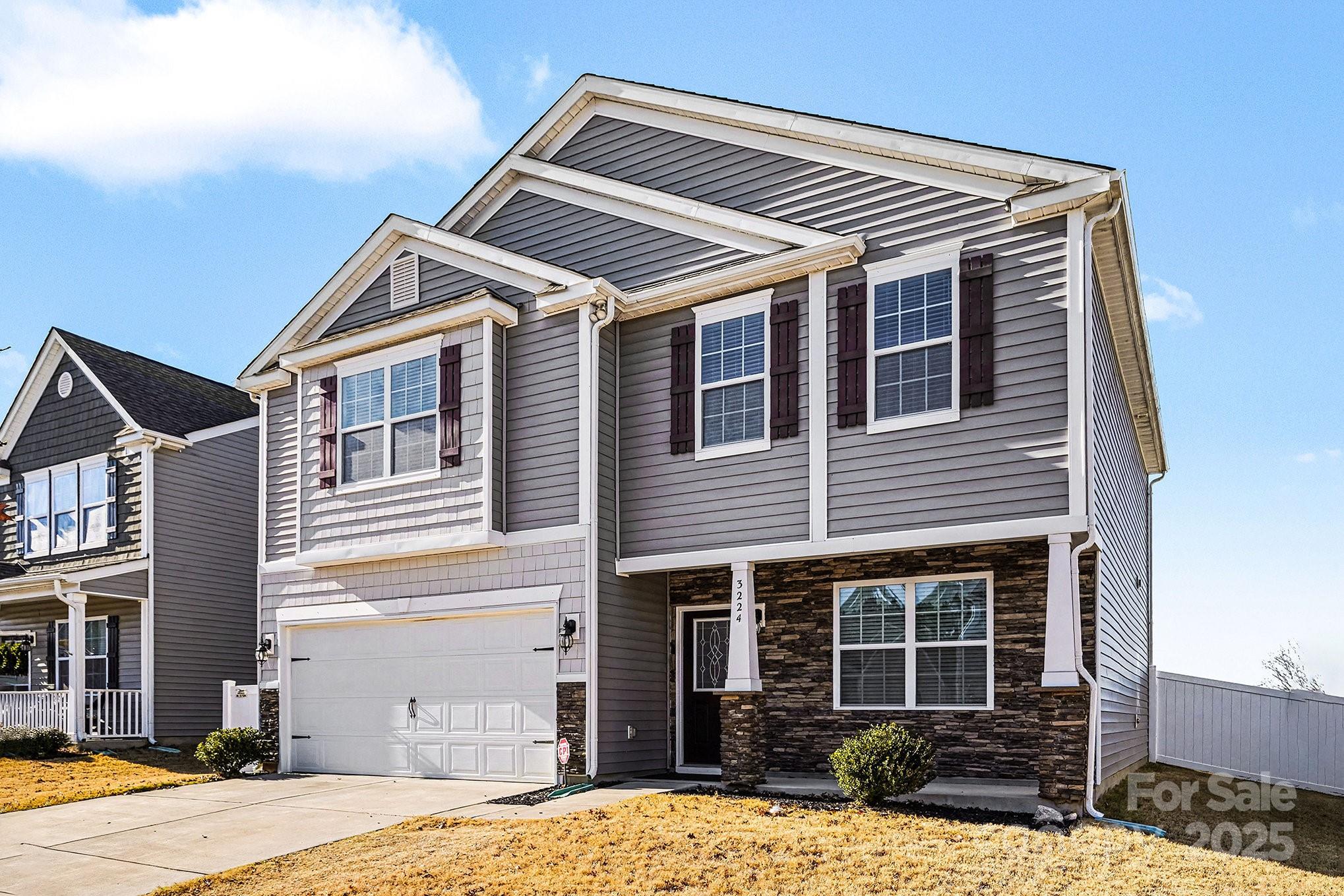 3224 Hawksbill Street Southwest Concord, NC 28027 - Photo 3 of 35 a front view of a house with a yard