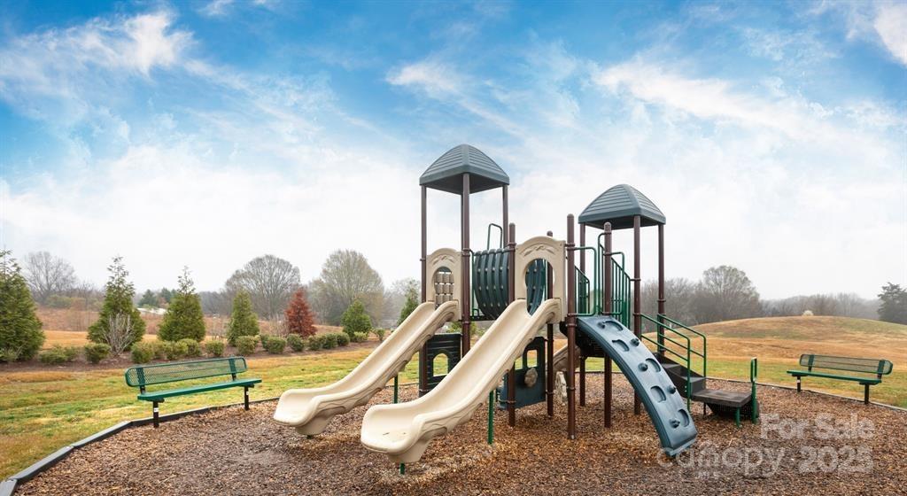 3224 Hawksbill Street Southwest Concord, NC 28027 - Photo 33 of 35 a view of a swimming pool with a lounge chair