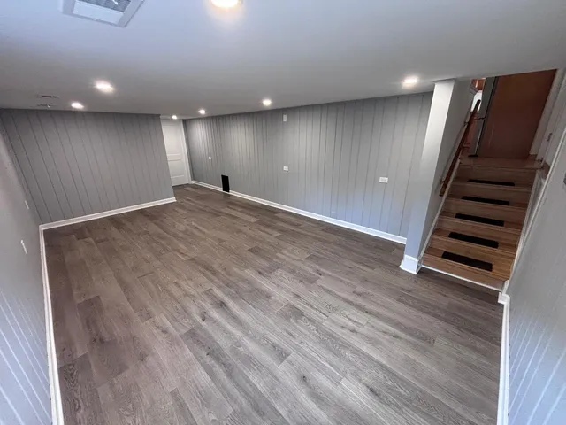 an empty room with wooden floor