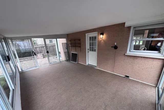 a view of an empty room with a fireplace