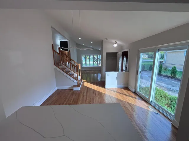 a view of a hallway view with staircase