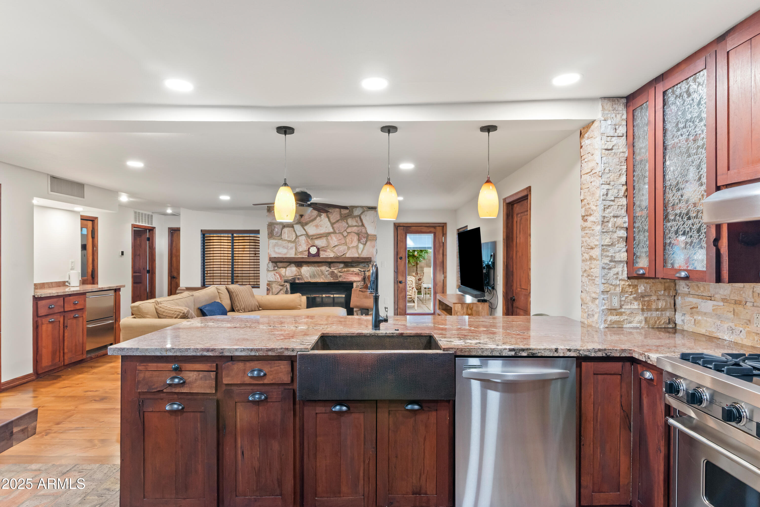 7502 North 7th Avenue Phoenix, AZ 85021 - Photo 11 of 56 a kitchen with a sink stove and cabinets