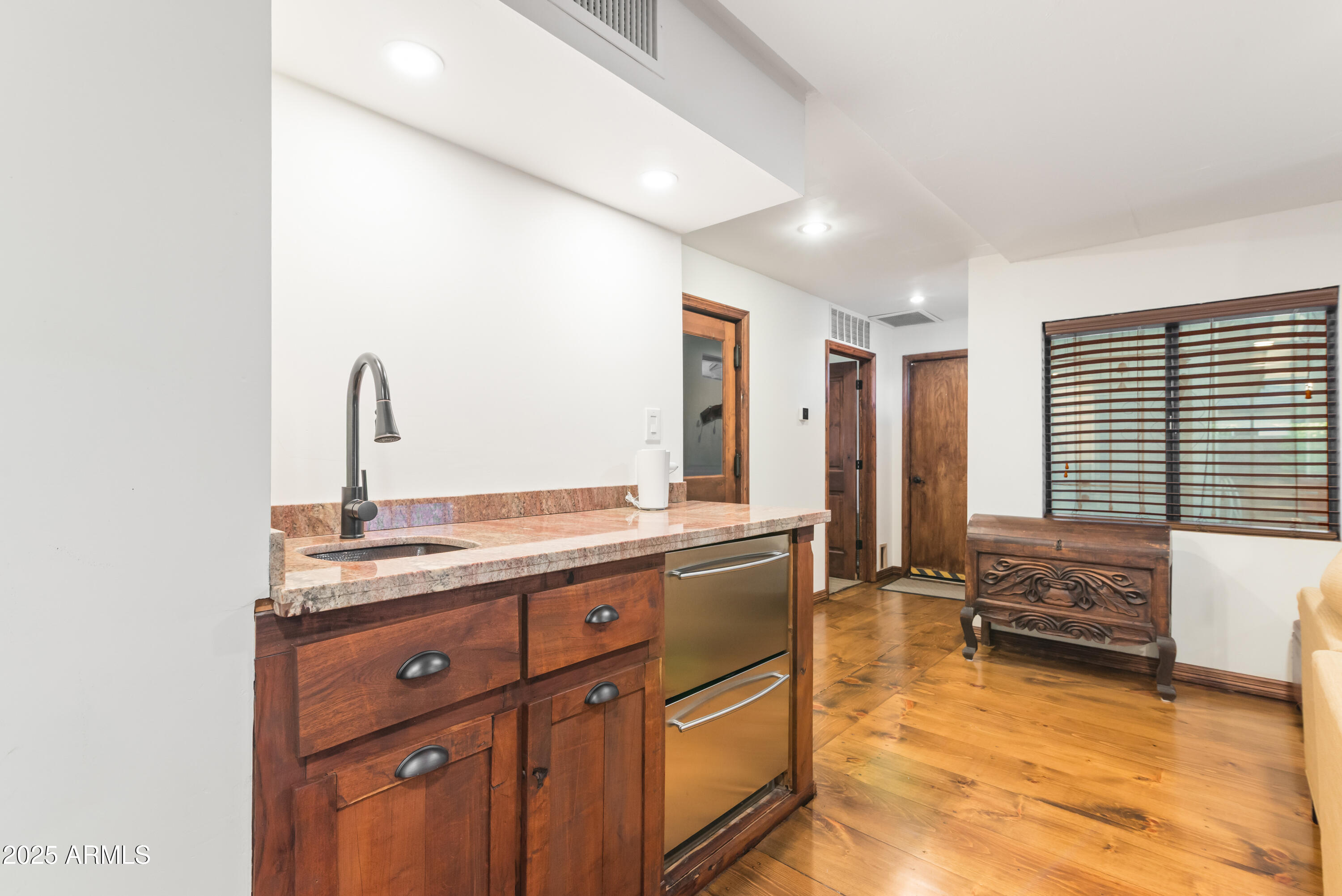 7502 North 7th Avenue Phoenix, AZ 85021 - Photo 17 of 56 a spacious bathroom with a granite countertop sink and a bathtub