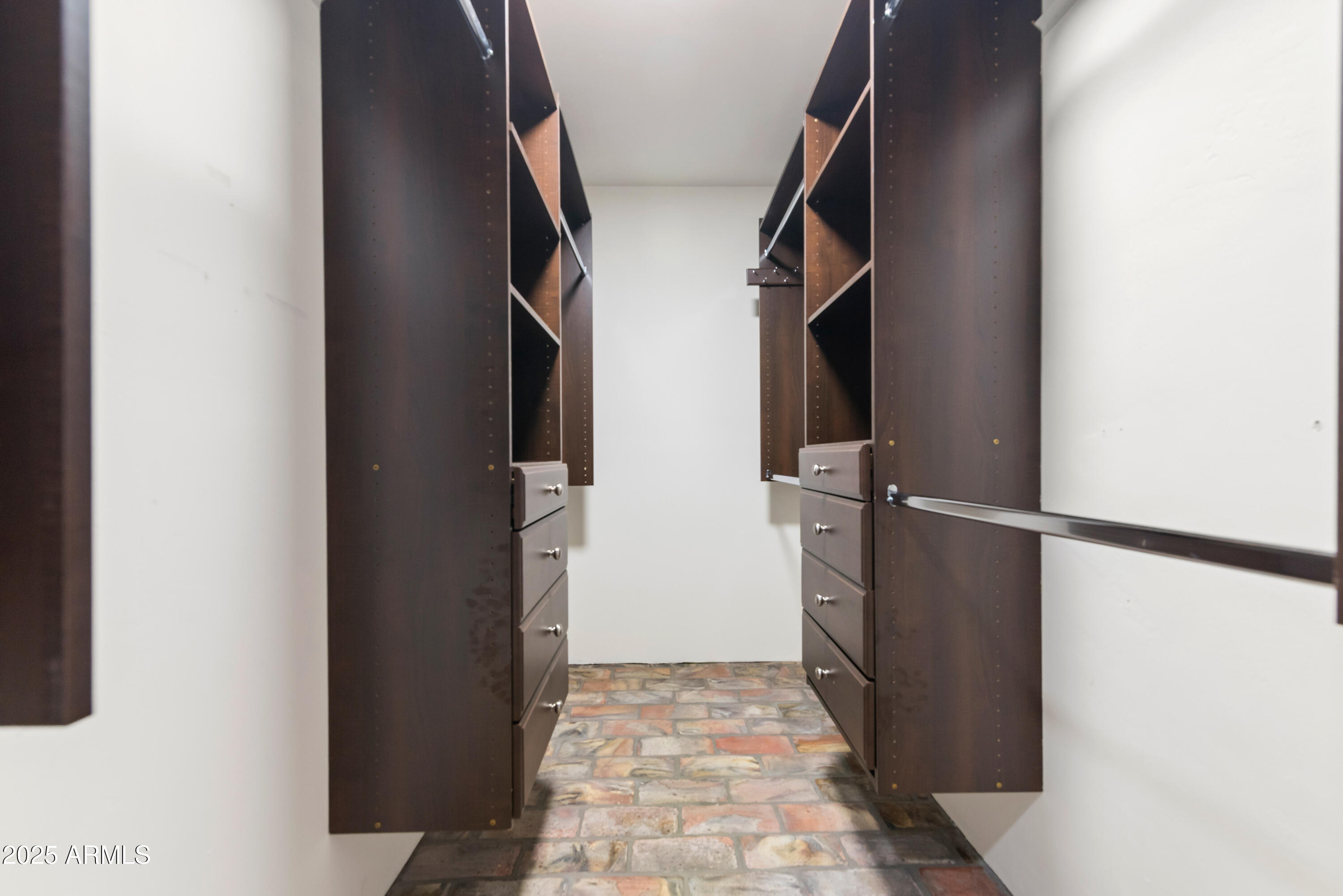 7502 North 7th Avenue Phoenix, AZ 85021 - Photo 22 of 56 a view of walk in closet with clothes