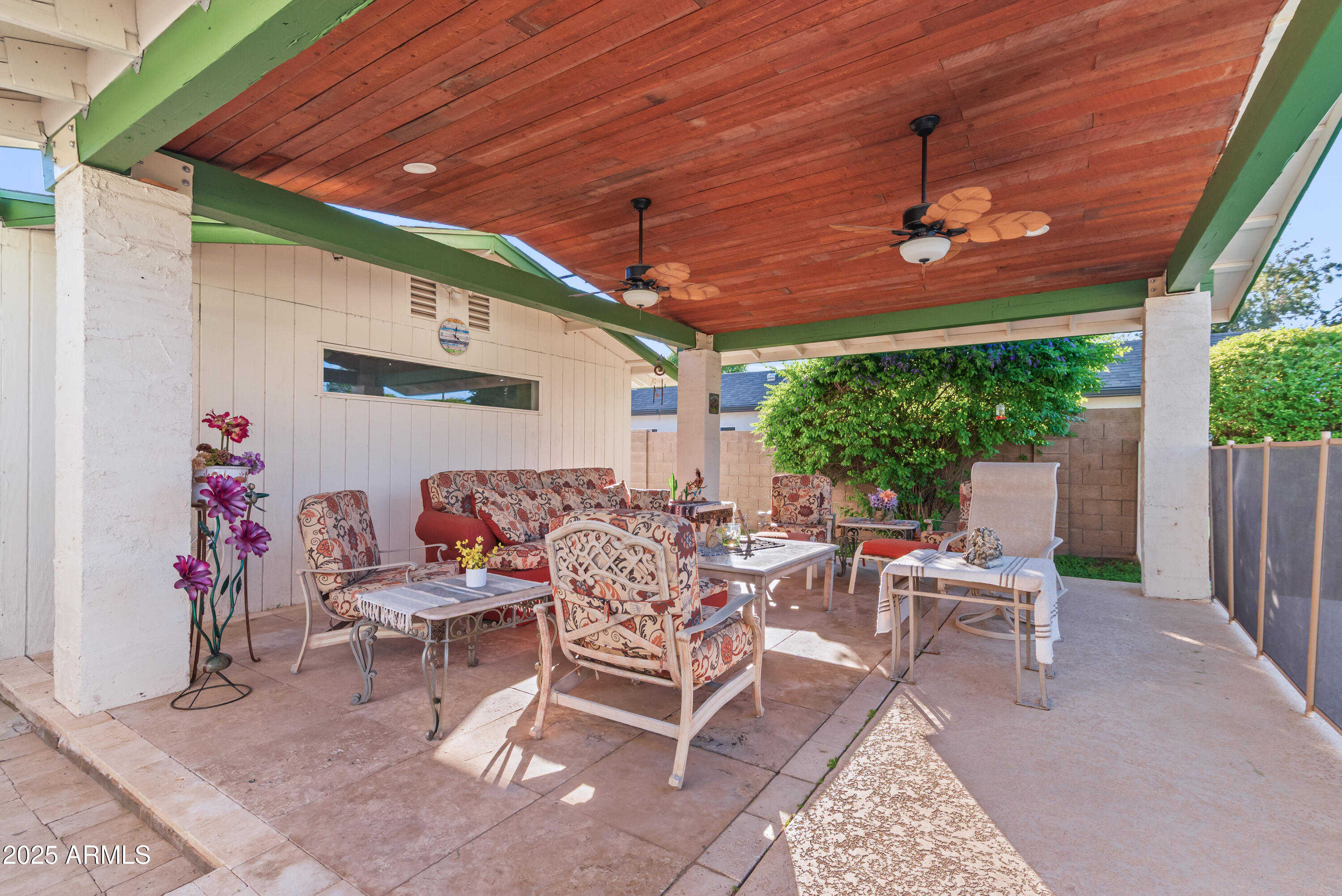 7502 North 7th Avenue Phoenix, AZ 85021 - Photo 44 of 56 a view of a patio with a table and chairs under an umbrella