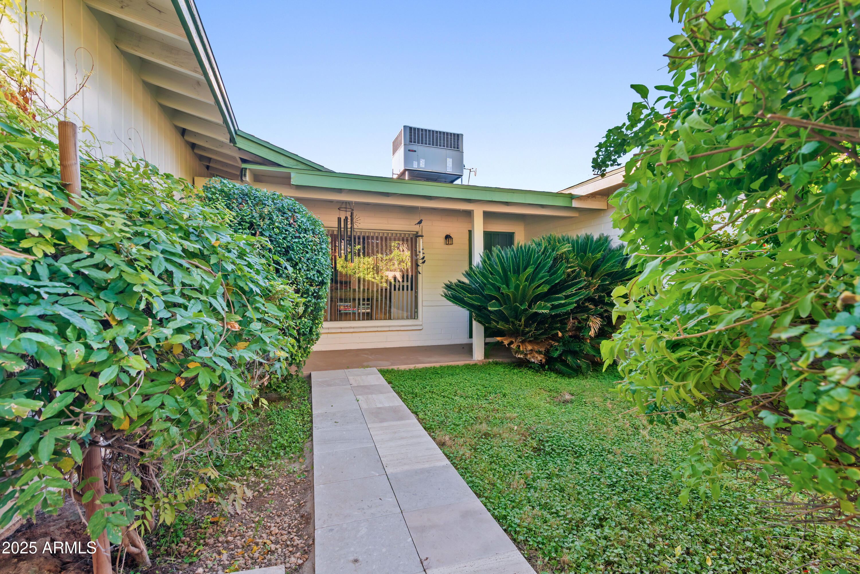 7502 North 7th Avenue Phoenix, AZ 85021 - Photo 46 of 56 a view of a house with a small yard and a plants