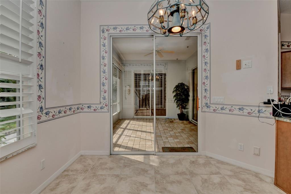 58 Byrsonima Loop Homosassa, FL 34446 - Photo 20 of 43 a view of a hallway with a livingroom and dining chair