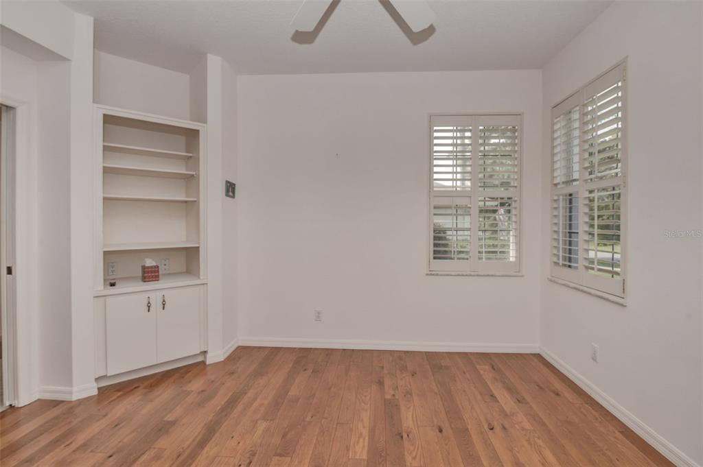 58 Byrsonima Loop Homosassa, FL 34446 - Photo 23 of 43 a view of an empty room with a window and wooden floor