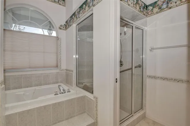 a bathroom with a bathtub and shower