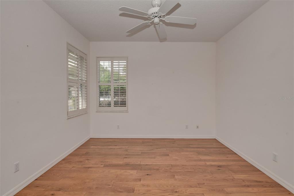 58 Byrsonima Loop Homosassa, FL 34446 - Photo 27 of 43 wooden floor in an empty room with a window