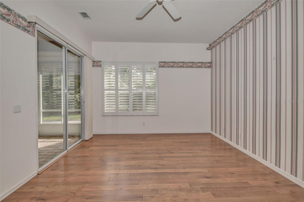 58 Byrsonima Loop Homosassa, FL 34446 - Photo 29 of 43 a view of an empty room with wooden floor and a window