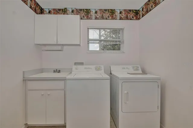 a utility room with dryer and washer