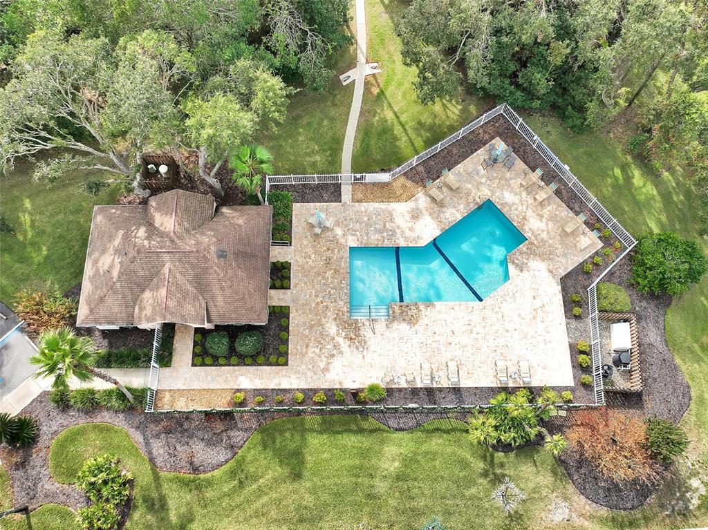 58 Byrsonima Loop Homosassa, FL 34446 - Photo 42 of 43 an aerial view of a house with swimming pool and outdoor space