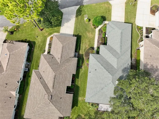 an aerial view of a house with outdoor space