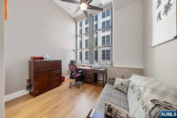 a bedroom with a bed and a desk
