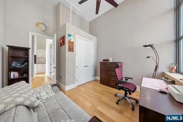 a bedroom with a workspace