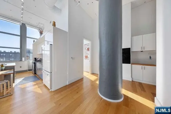 a view of kitchen living room with wooden floor