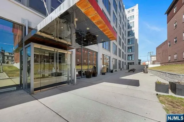 a view of a building with car parked