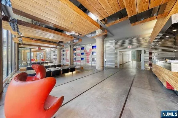 a lobby with furniture and rug