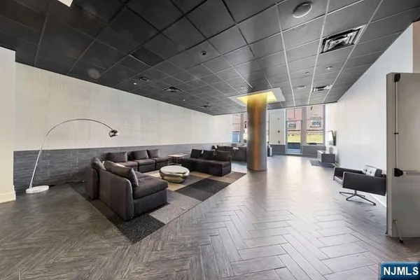 a lobby with furniture and stairs