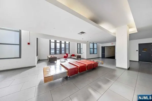 a large bedroom with bed and window