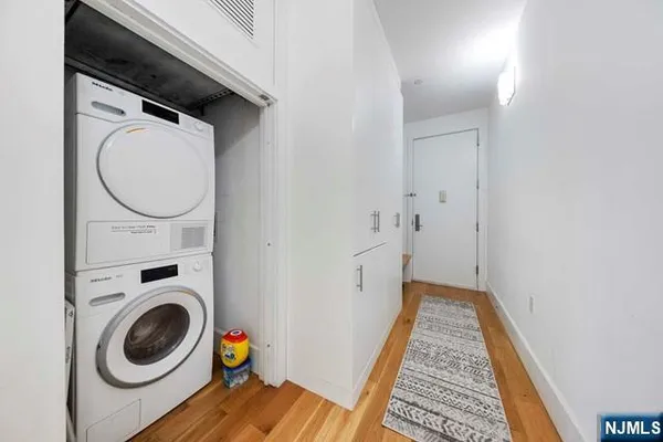 a utility room with sink dryer and washer